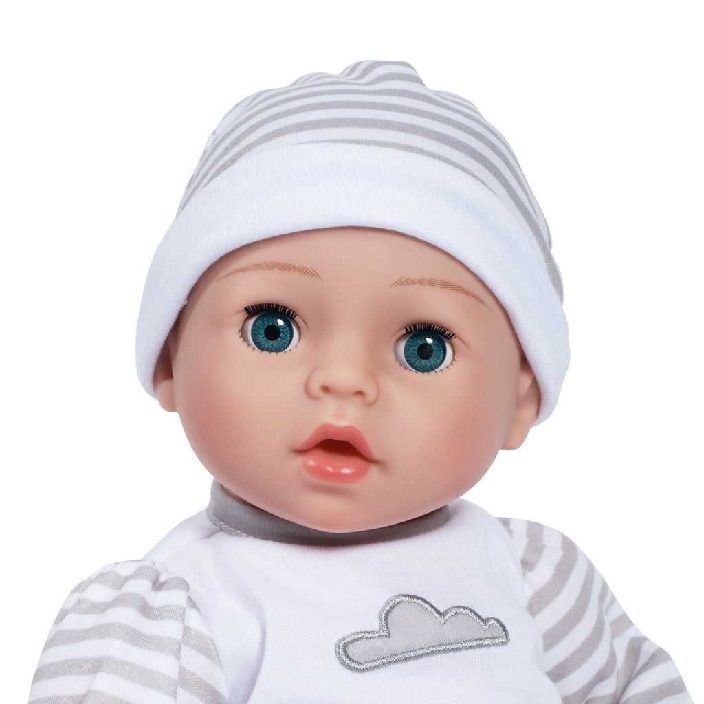 Gender-neutral baby doll set comes with one 16" weighted baby doll, a Certificate of Adoption, a pacifier, a hospital bracelet, a disposable diaper, a baby blanket, a crib, and a removable striped, cloud-print onesie with a matching cap.