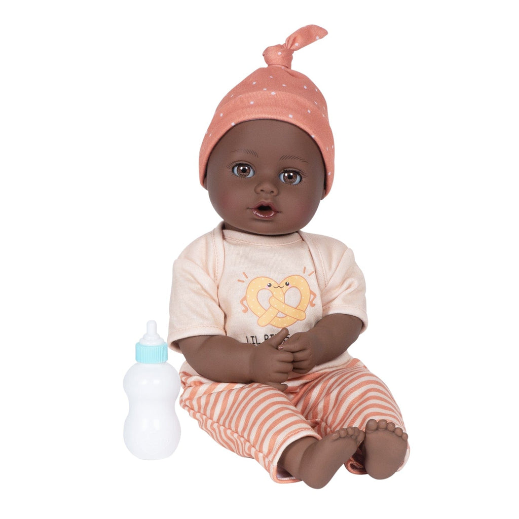 Adora Sweet Pretzel baby doll set includes one 13-inch African American doll, pretzel-printed shirt, pants, matching beanie, blue baby bottle.  Made for Ages 1+.