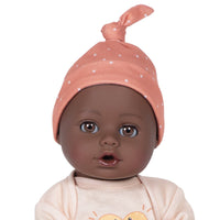 Adora Sweet Pretzel baby doll set includes one 13-inch African American doll, pretzel-printed shirt, pants, matching beanie, blue baby bottle.  Made for Ages 1+.