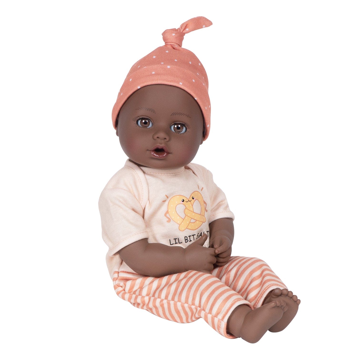 Adora Sweet Pretzel baby doll set includes one 13-inch African American doll, pretzel-printed shirt, pants, matching beanie, blue baby bottle.  Made for Ages 1+.