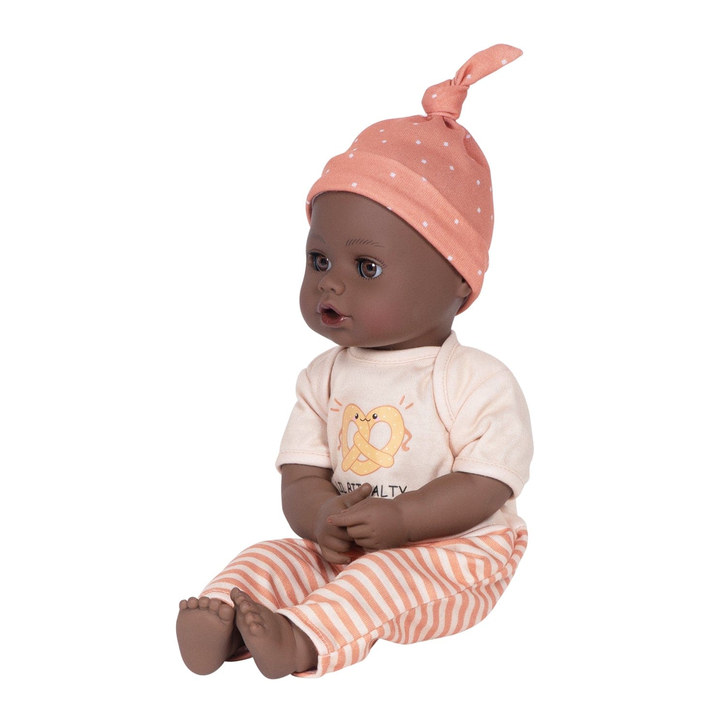 Adora Sweet Pretzel baby doll set includes one 13-inch African American doll, pretzel-printed shirt, pants, matching beanie, blue baby bottle.  Made for Ages 1+.