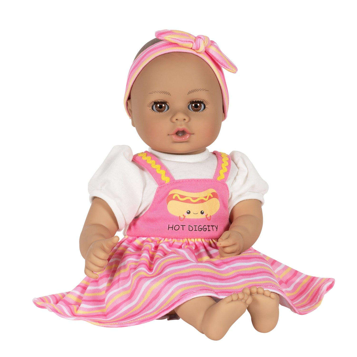 Adora Hot Diggity Dog baby doll set includes one 13-inch doll, a hot dog-printed one-piece dress with white undershirt, matching headband, white bloomers, and a pink baby bottle. Made for Ages 1+.