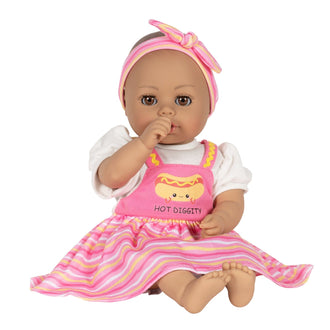 Adora Hot Diggity Dog baby doll set includes one 13-inch doll, a hot dog-printed one-piece dress with white undershirt, matching headband, white bloomers, and a pink baby bottle. Made for Ages 1+.