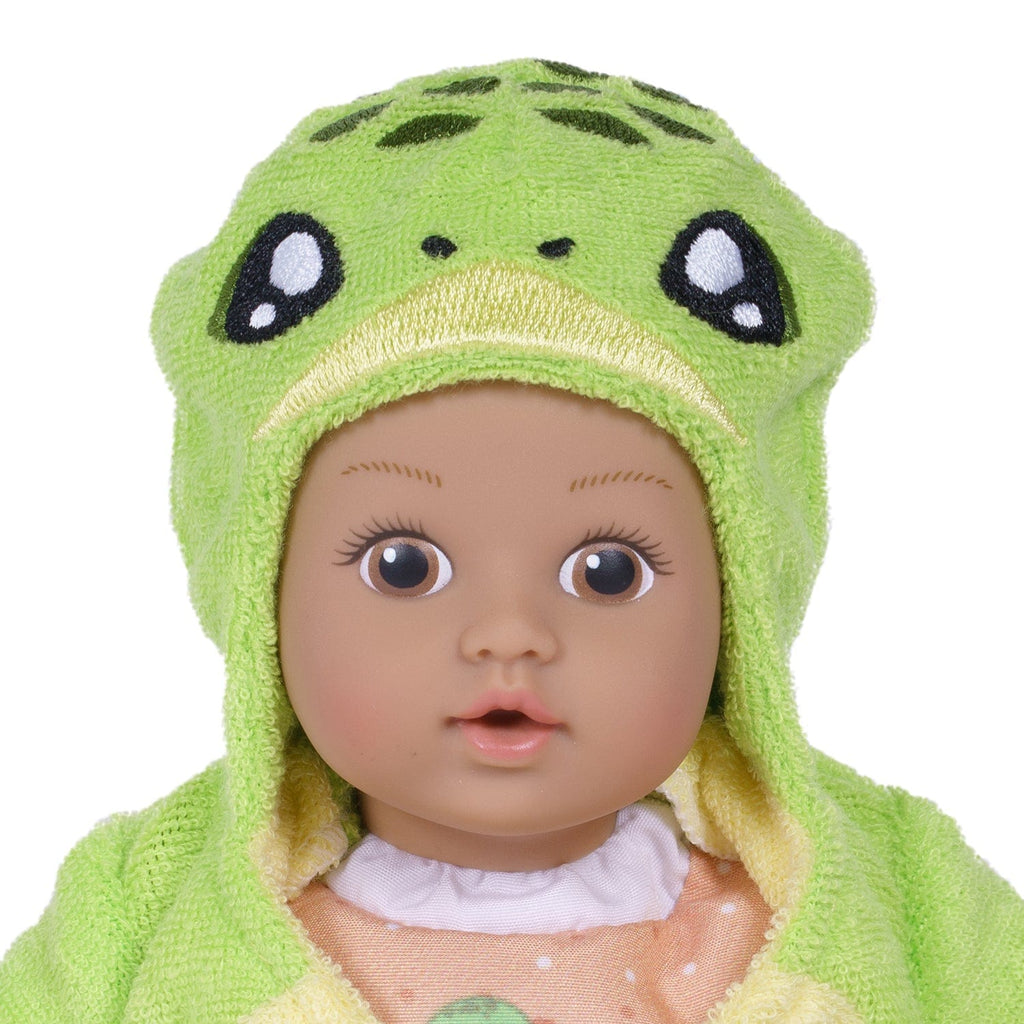 Adora BathTime baby doll set comes with one 8.5-inch baby doll boy, an attached sandy-colored sea turtle-print swimsuit, and an embroidered hooded Sea Turtle terry bathrobe complete with an embroidered face and green turtle shell on the back. 100% machine washable - made to love and last with Adora's exclusive Quick Dry fabric. 